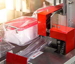 Industrial packaging process with plastic film